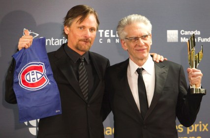 Actor Viggo Mortensen with Montreal Canadiens flag joins Director David Cronenberg with his Life Time Achievement award at the Viggo Mortensen Photo: PC