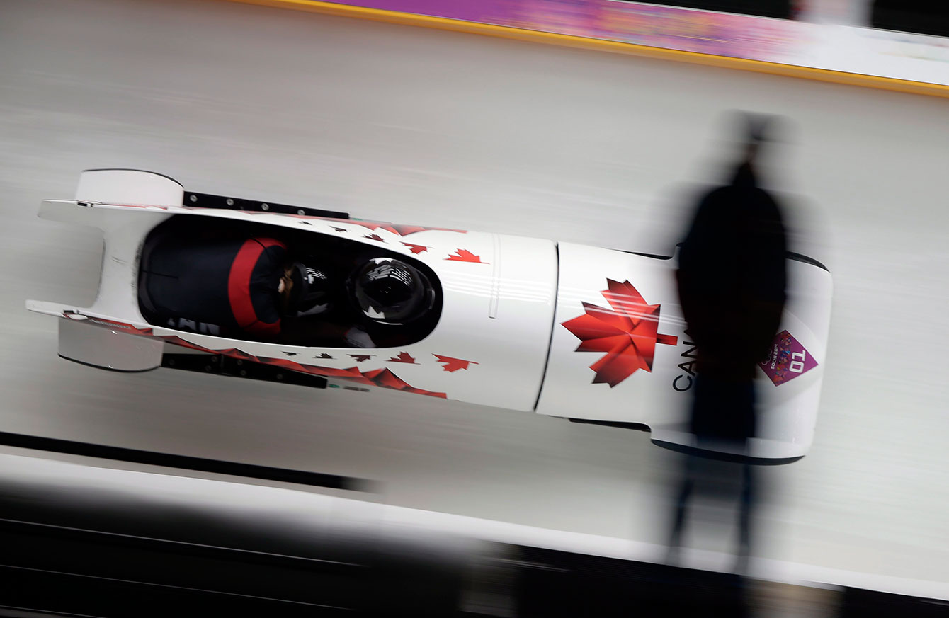 Kaillie Humphries et Heather Moyse pendant la finale de bobsleigh à Sotchi.