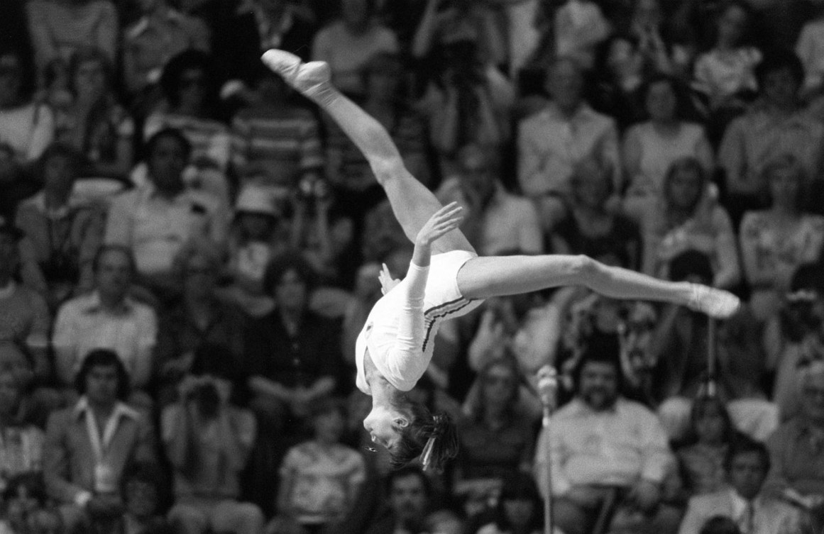 Nadia Comaneci mid-flip