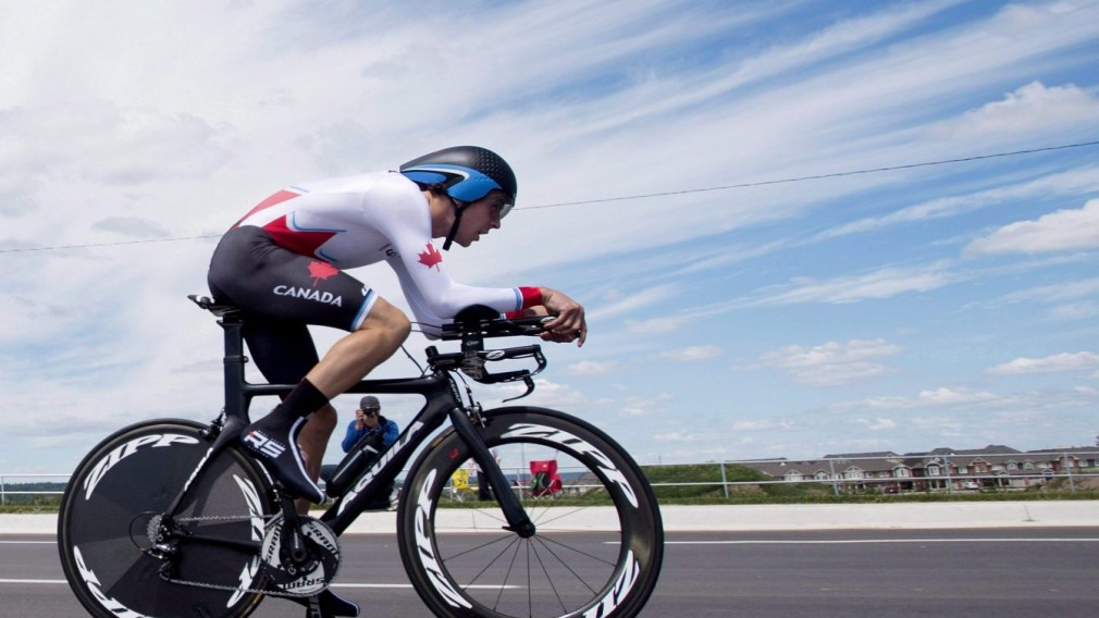 Sean MacKinnon of Canada rides his way to winning the bronze medal in men's individual time trial road cycling at the 2015 Pan Am Games in Milton, Ont.