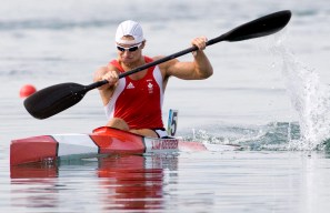 Adam van Koeverden paddles his kayak