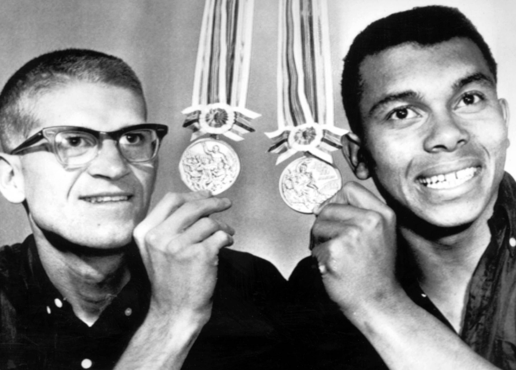 Bill Crothers and Harry Jerome with their silver and bronze medals from the Tokyo 1964 Olympic Games. 