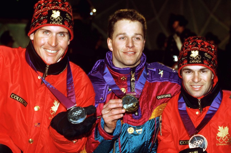 Canada's Philippe Laroche (left) and Lloyd Langlois (right) celebrate after winning respectively silver and bronze medals in the men's freestyle ski aerials event at the Lillehammer 1994 Olympic Winter Games. (CP Photo/ COC/Claus Andersen)