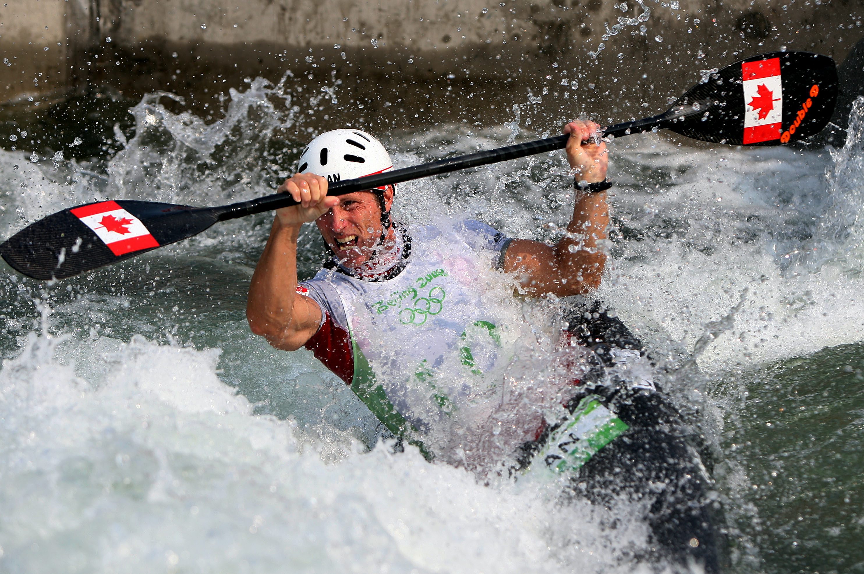 A slalom kayaker races through whitewater