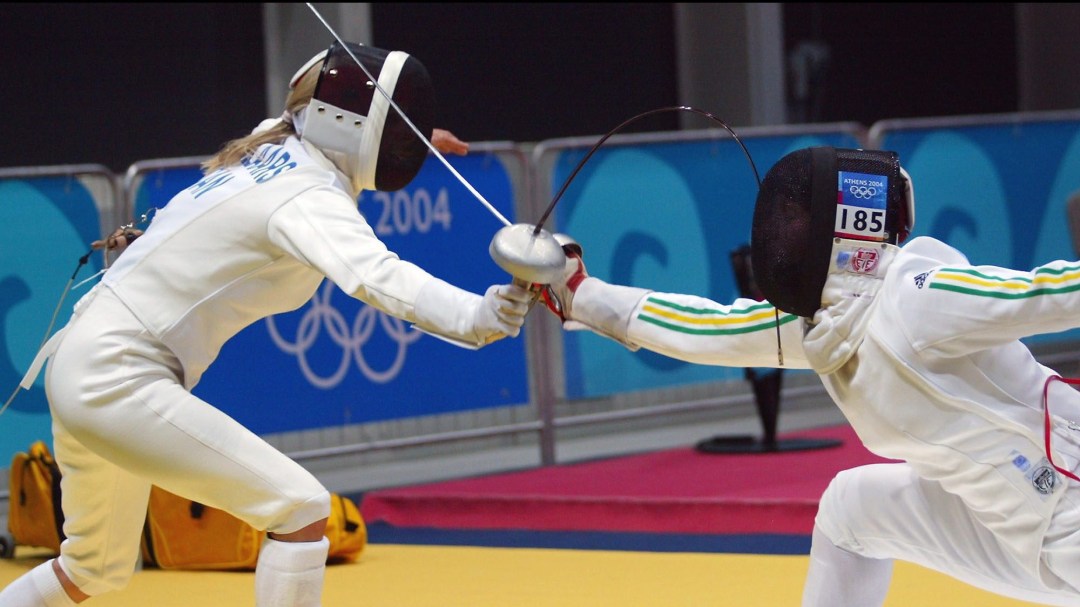 Two fencers in a bout