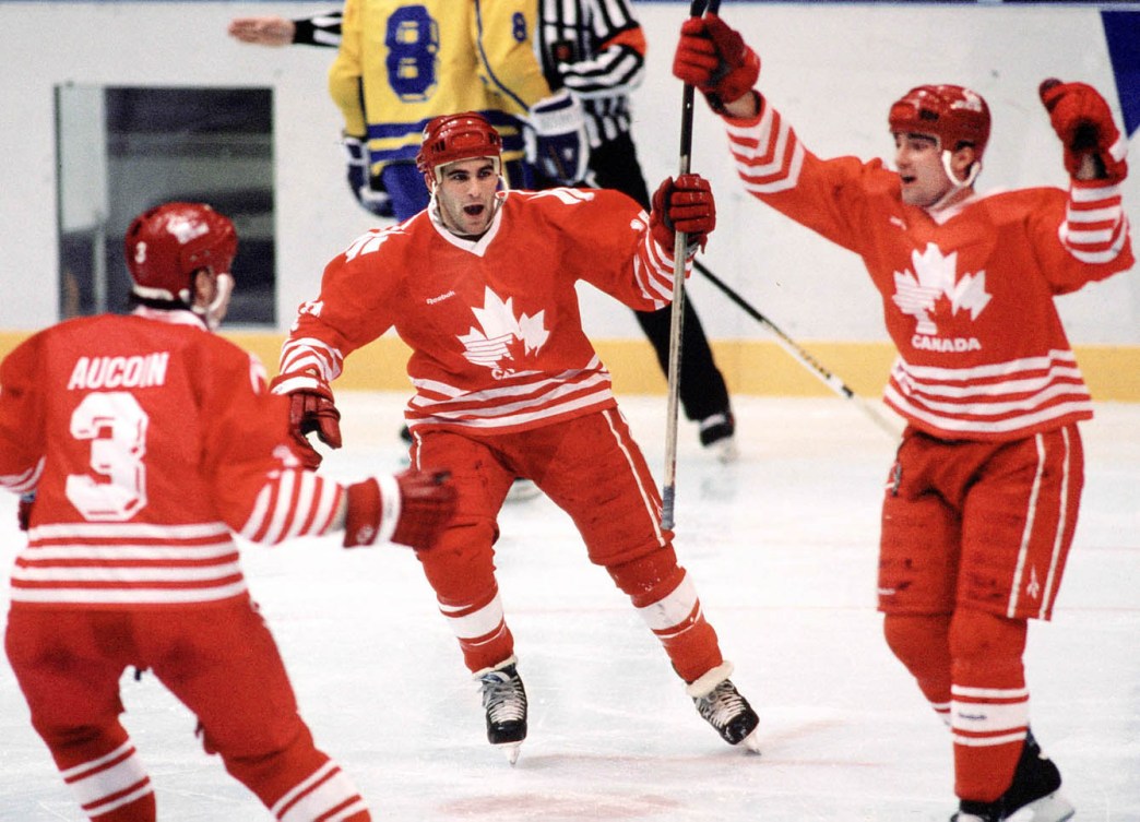 Aucoin, Adrian,  Norris, Dwayne and Hlushko, Todd celebrating on the ice