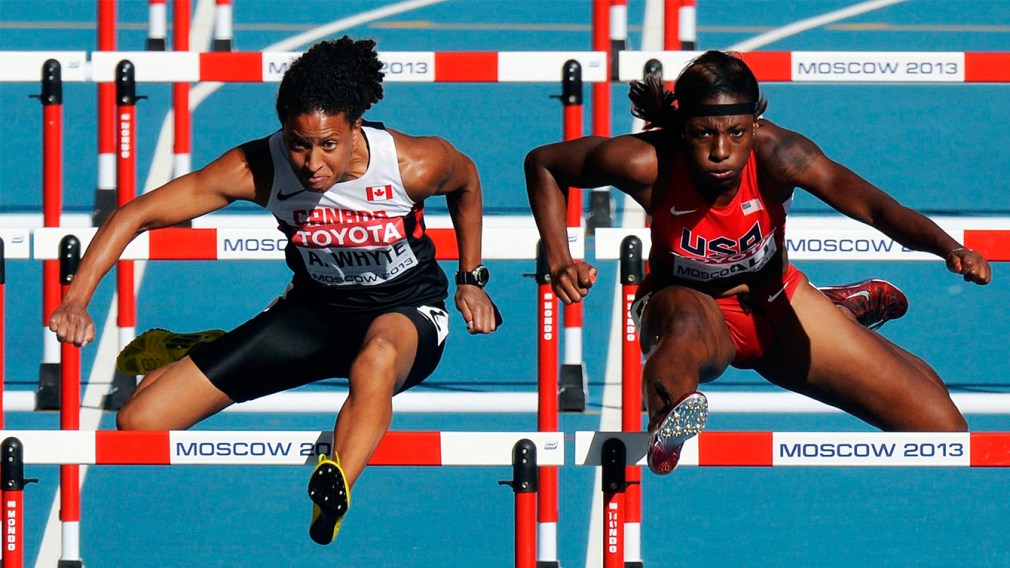 Angela Whyte jumping over a hurdle