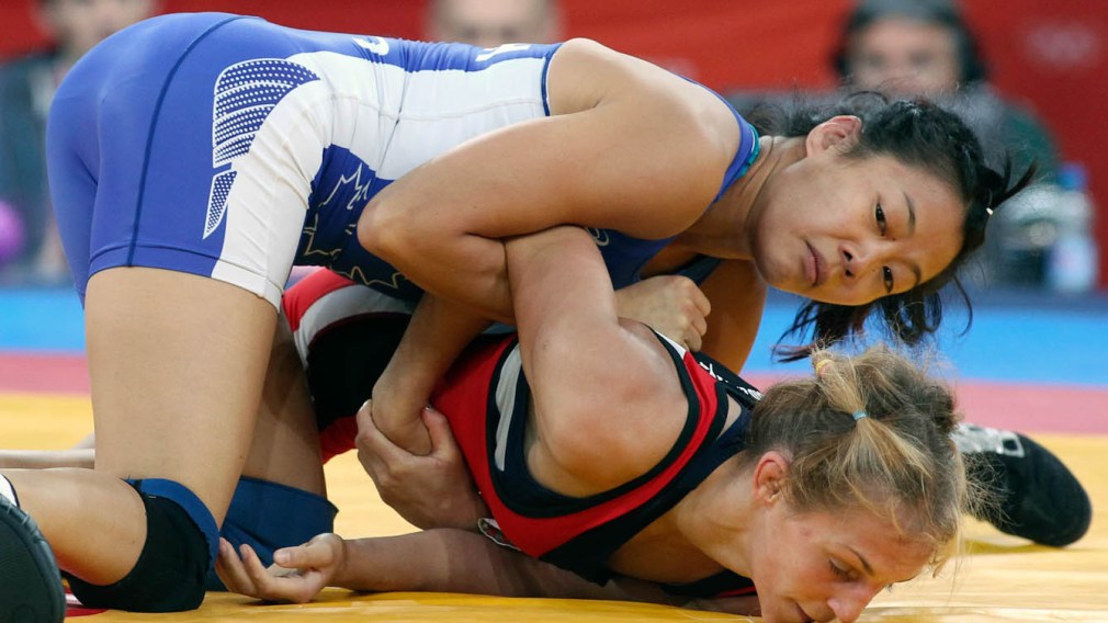 Two female wrestlers on the ground