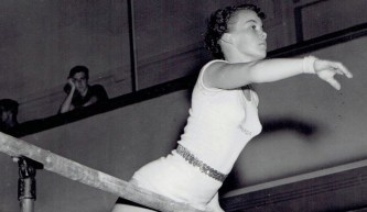 Ernestine Russell competing in gymnastics