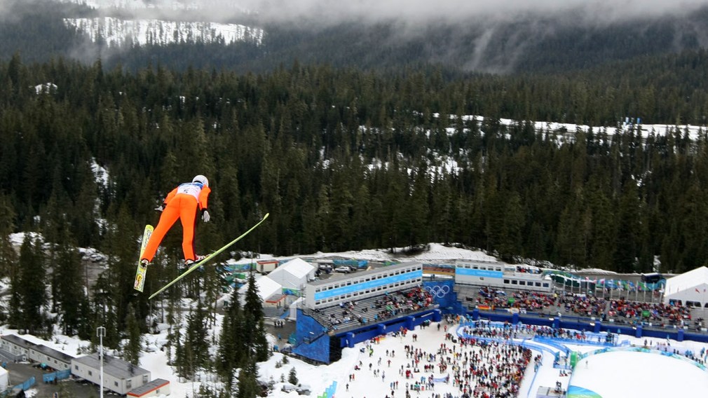 Wide shot of Jason Myslicki ski jumping