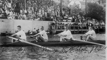 Joseph Wright, left, rowing with his team