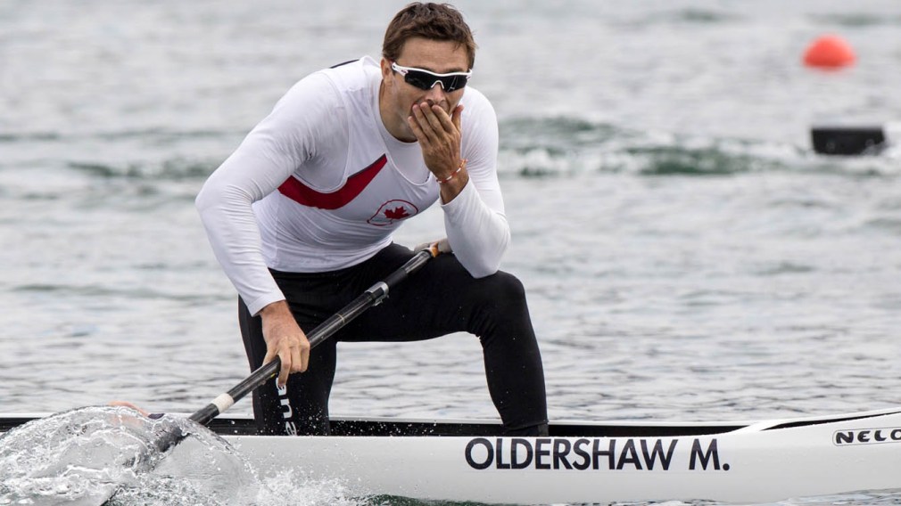 Mark Oldershaw reacts to his bronze medal win on a canoe
