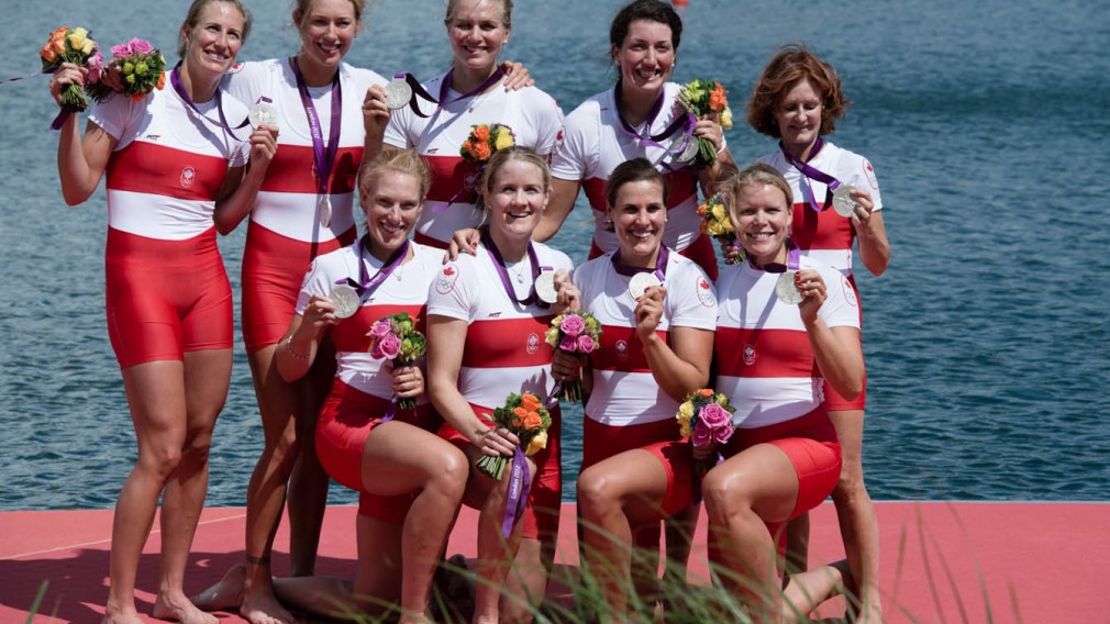 The women's eights team poses with their medals