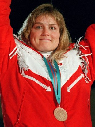 Canada's Karen Percy celebrates her bronze medal win in the alpine ski event at the 1988 Olympic Winter Games in Calgary. (CP PHOTO/ COC/S. Grant)