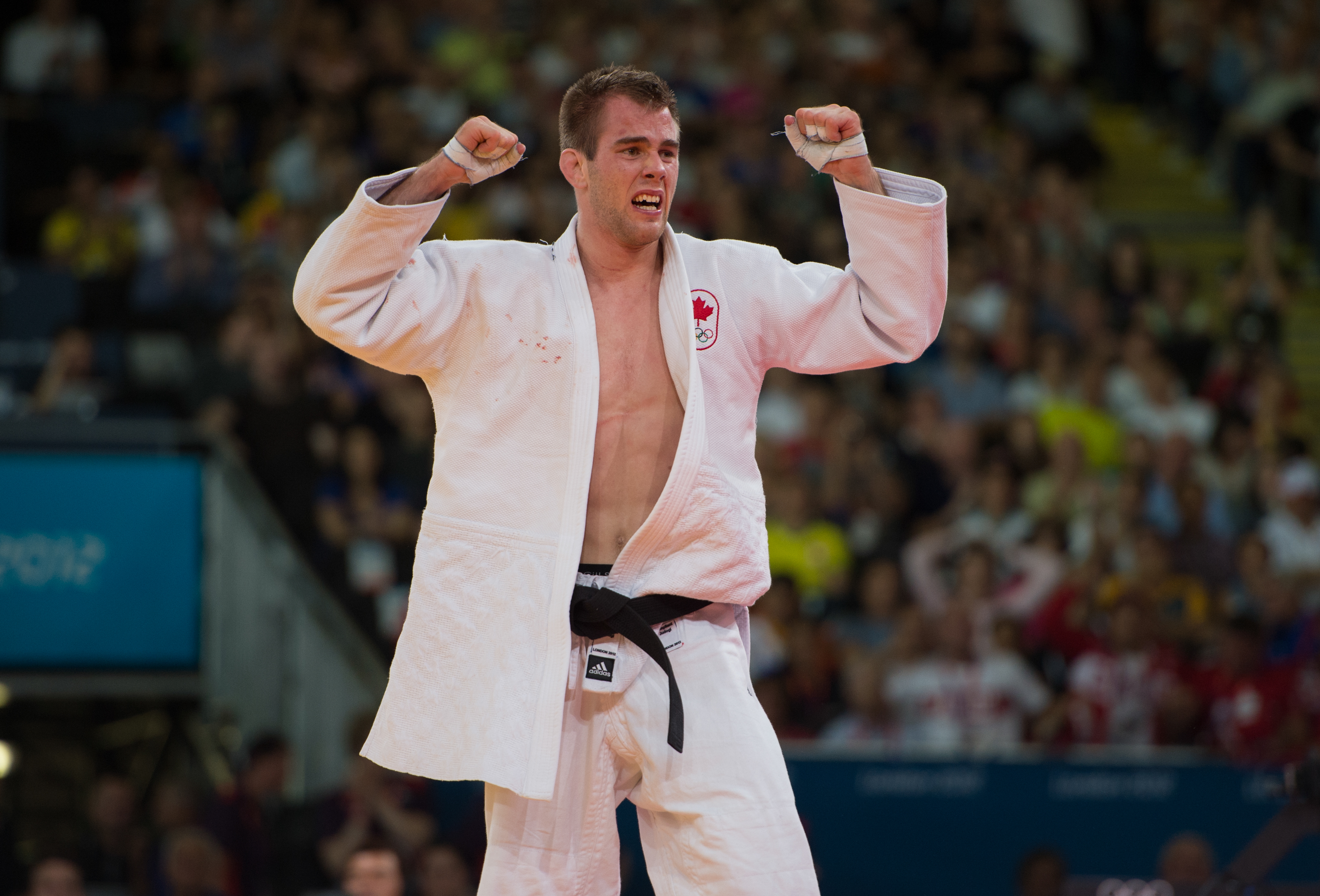 An emotional Antoine Valois-Fortier of Canada, white, celebrates a win over Travis Stevens of the USA for a bronze medal in judo at the 2012 London Olympics, on July 31, 2012. THE CANADIAN PRESS/HO, COC - Jason Ransom