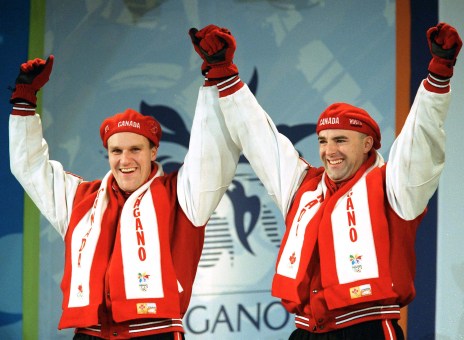 Canada's Pierre Lueders (left) and Dave MacEachern celebrate their gold medal win in the two-man bobsleigh event at the 1998 Nagano Winter Olympics. (CP PHOTO/COC/F. Scott Grant)