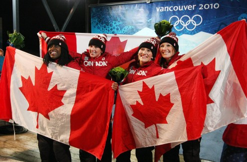 Kaillie Humphries and Heather of Canada celebrate their gold medal with teammates and silver medalists Helen Upperton and Shelley-Ann Brown during ladies 2 person bobsleigh at the 2010 Vancouver Olympic Winter Games in Whistler, B.C. THE (CANADIAN PRESS)2010(HO-COC-Dave Sandford)