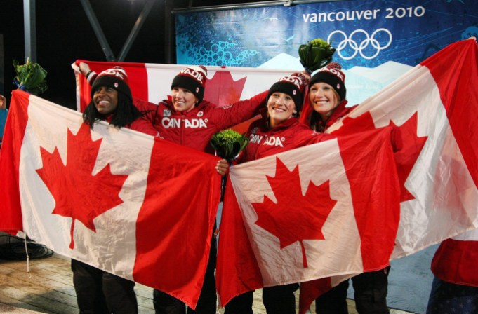Team Canada Bobsleigh Vancouver 2010 Kaillie Humphries and Heather of Canada celebrate their gold medal with teammates and silver medalists Helen Upperton and Shelley-Ann Brown during ladies 2 person bobsleigh at the 2010 Vancouver Olympic Winter Games in Whistler, B.C. THE (CANADIAN PRESS)2010(HO-COC-Dave Sandford)
