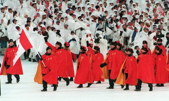 Canadian figure skater Kurt Browning carries the flag as he leads Olympic teammates onto the field during opening ceremony for the XVII Olympic Winter Games in Lillehammer Feb. 12, 1994. THE CANADIAN PRESS/Ron Poling