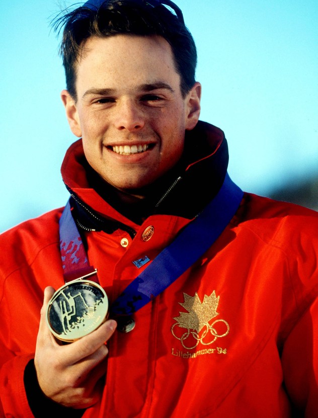 Canada's Jean-Luc Brassard celebrates after winning the gold medal in the men's freestyle skiing moguls event at the Lillehammer 1994 Olympic Winter Games. (CP PHOTO/ COC/ Claus Andersen)