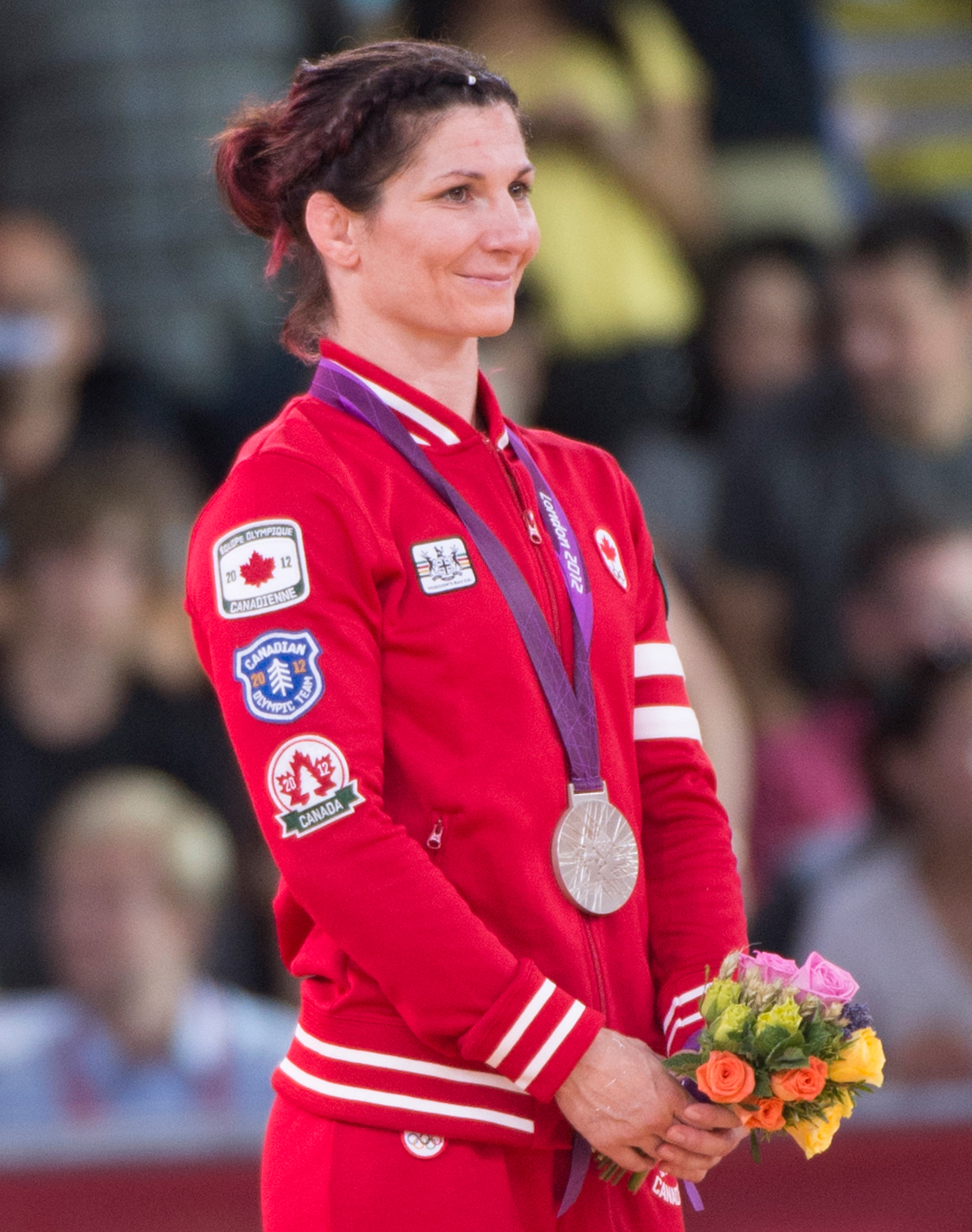 Canada's Tonya Verbeek wears her silver medal for wrestling in the 55kg freestyle category at the 2012 London Olympics, August 9, 2012. Verbeek lost to Saori Yoshida of Japan. THE CANADIAN PRESS/HO, COC - Jason Ransom