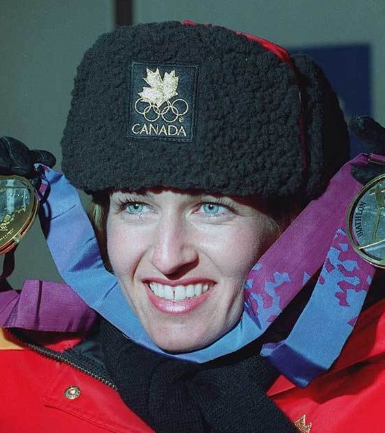 Canadian athlete posing with her two medals