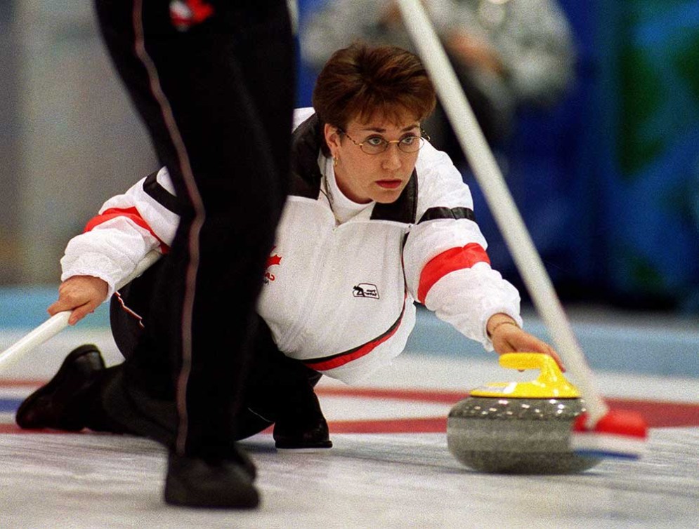 an athlete curling