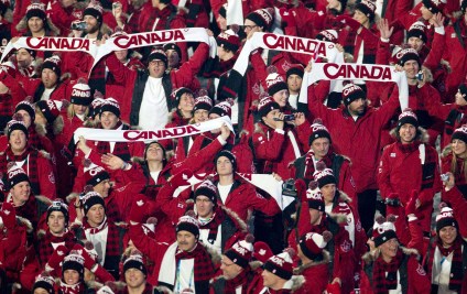 Canadian team members hold up Canada scarves during the athlete's parade at the opening ceremonies for the Vancouver 2010 Olympic Winter Games in Vancouver, Friday, Feb. 12, 2010. THE CANADIAN PRESS/Jonathan Hayward