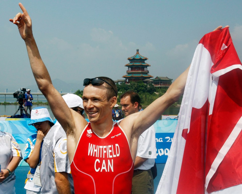 Simon Whitfield celebrates in Beijing, he was also Canada's opening ceremony flag bearer at London 2012.