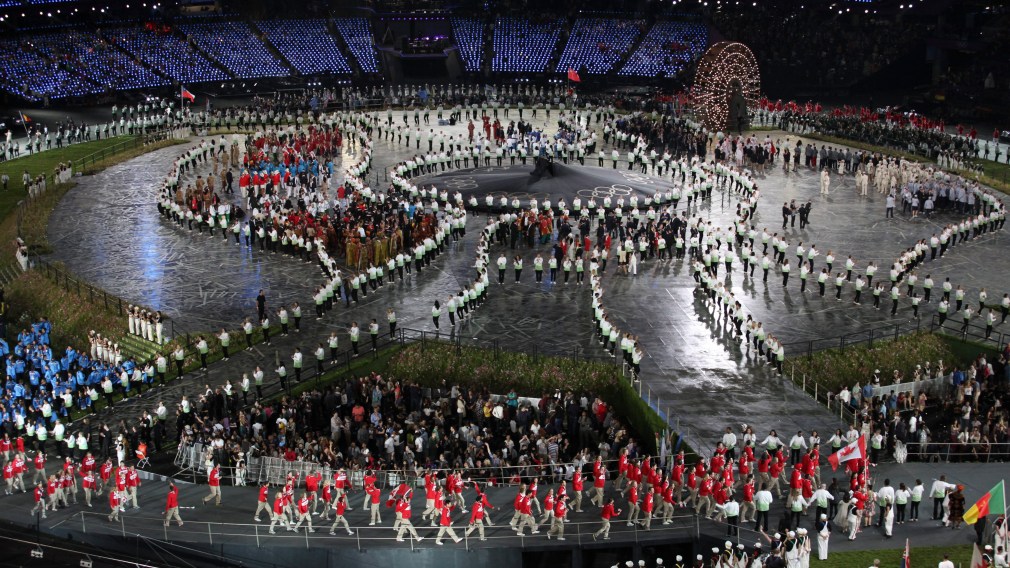 The Canadian Olympic team marches into the opening ceremony behind flag bearer Simon Whitfield at the 2012 London Olympics,