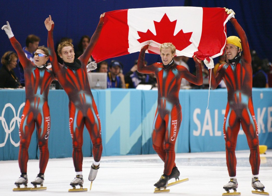 GUILMETTE-GAGNON-TURCOTTE-TREMBLAY celebrating with the Canadian flag