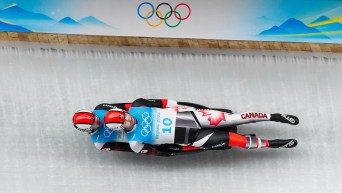 Doubles luge team slide down ice track