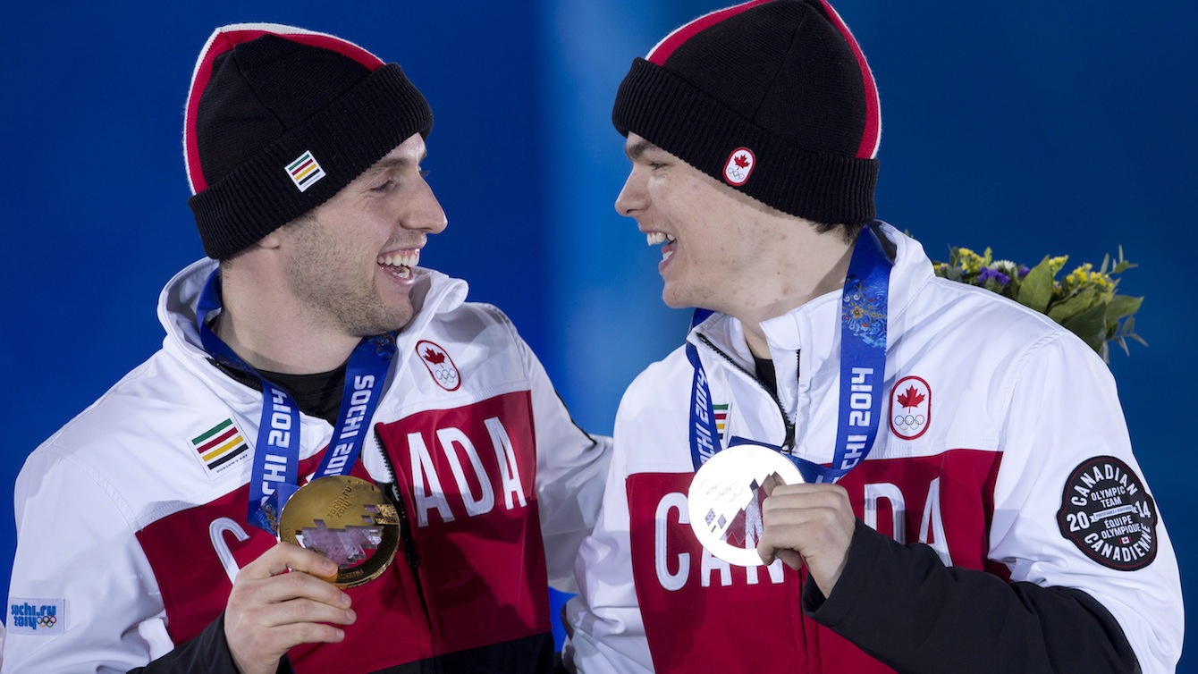 Alex Bilodeau (left) and Mikaël Kingsbury celebrate their gold and silver moguls medals from Sochi 2014. 