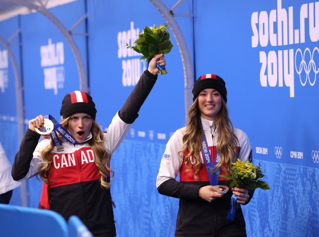 Justine Dufour-Lapointe receives her gold medal and her sister Chloe a silver
