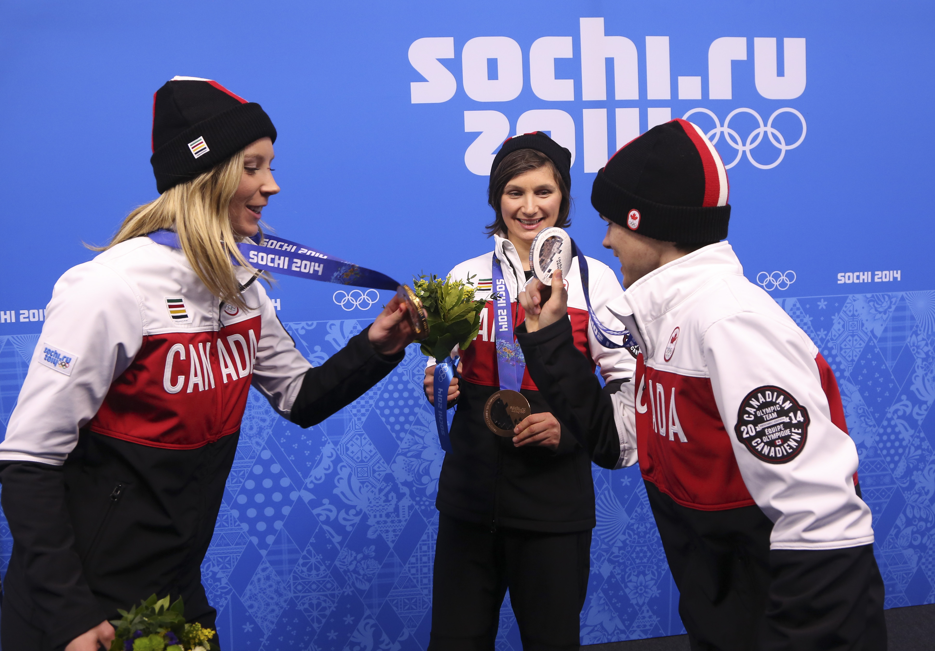 Dara Howell and Kim Lamarre with Mikaël Kingsbury