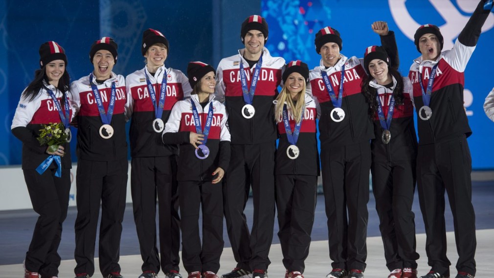 Team Canada posing for a picture with their medals