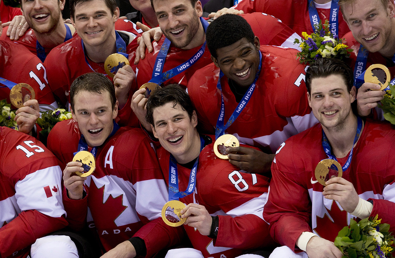 Team Canada captain Sidney Crosby celebrates with other Canada players after defeating Team Sweden to win the gold medal in Olympic final action at the Sochi 2014 Olympic Winter Games Sunday February 23, 2014 in Sochi, Russia. THE CANADIAN PRESS/Paul Chiasson