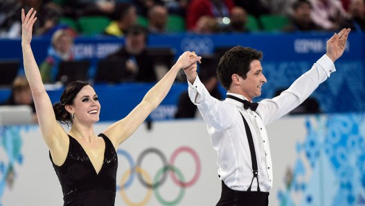 Canada's Tessa Virtue and Scott Moir perform their short dance in the ice dance portion of the team figure skating event at the Sochi Winter Olympics Saturday, February 8, 2014 in Sochi. THE CANADIAN PRESS/Paul Chiasson