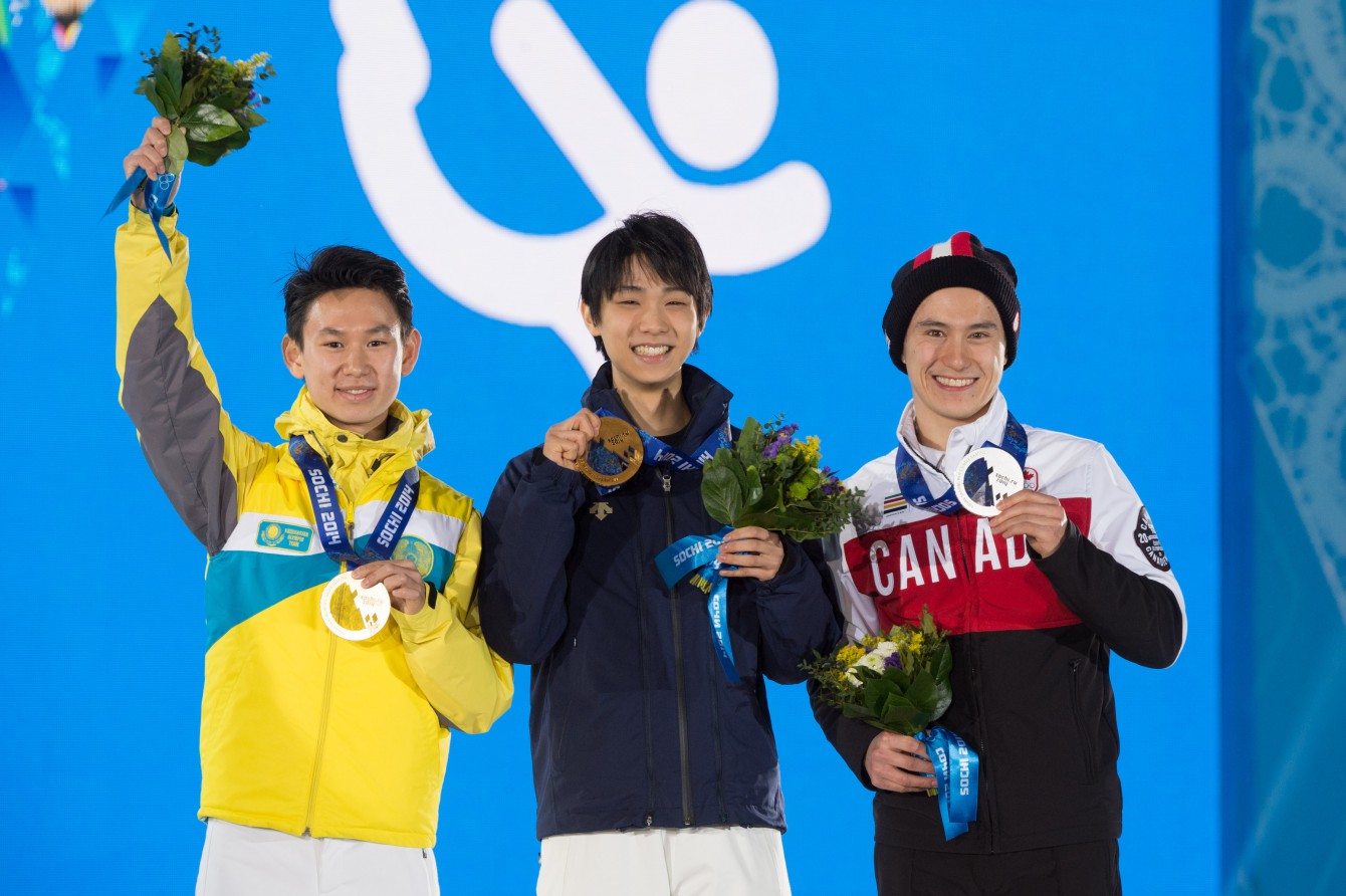 Patrick Chan (right) at Sochi 2014 men's Olympic figure skating medal ceremony .