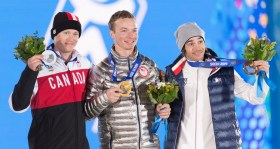 Mike Riddle receives the silver medal in men's ski halfpipe at the 2014 Sochi Winter Olympics