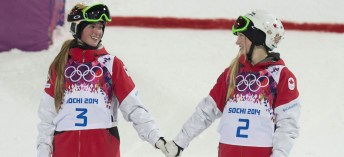 Canada's Justine Dufour-Lapointe and Chloe Dufour-Lapointe holds hands before climbing