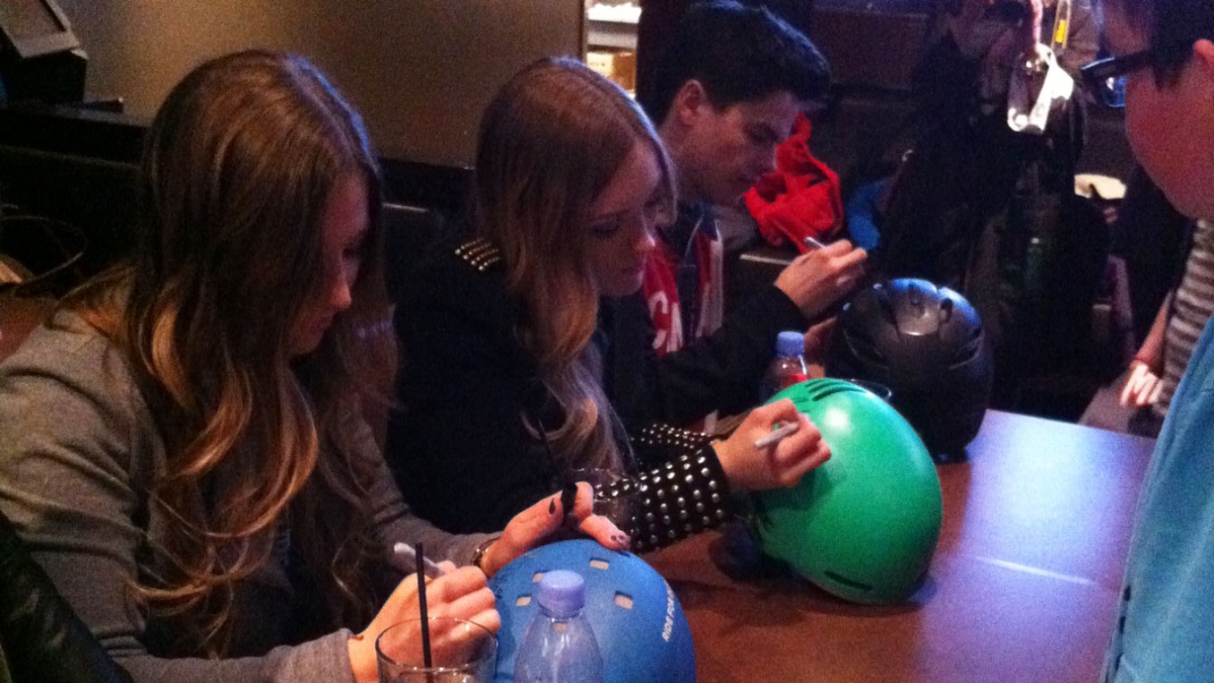 Mikaël joins the Dufour-Lapointe sisters in signing autographs for potential future Olympians. His mother Julie says he calls kids that look up to him "Young Miks."