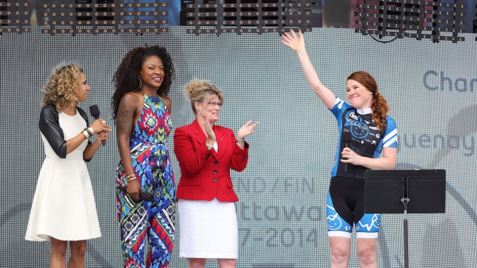 CanDay5 Hughes introduced to the crowd at the end of her 110-day bike tour of Canada.