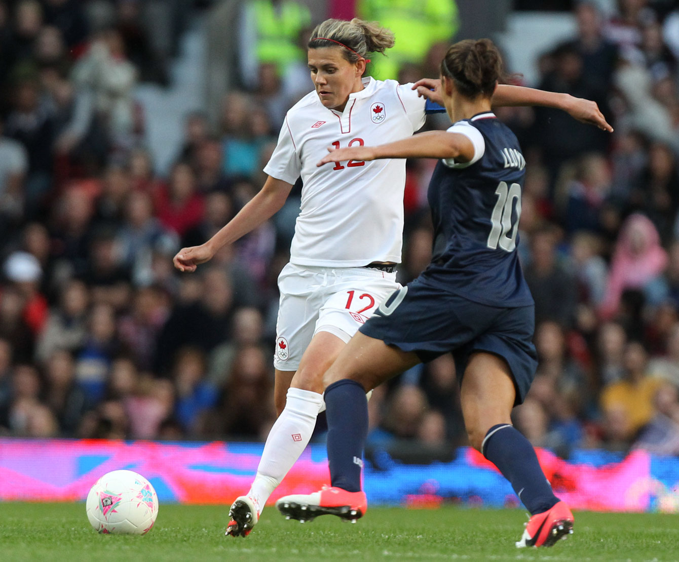 Christine Sinclair (left) at London 2012 against the United States in the semifinals. 