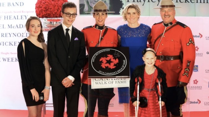 Hayley Wickenheiser has five Olympic medals (four gold). She was on hand to receive her star with family members and a 10-year old special guest, Grace. Photo: canadaswalkoffame.com