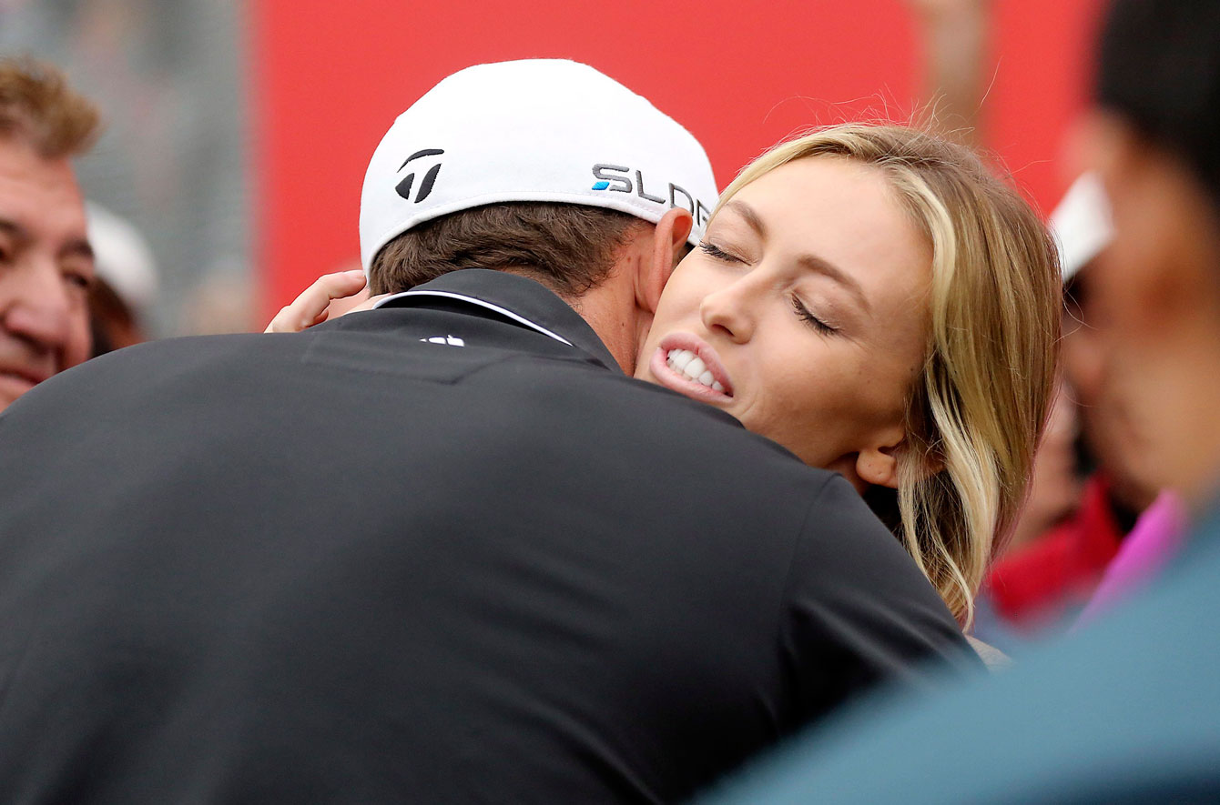Paulina gets a hug from fiancé Dustin Johnson. Photo: CP