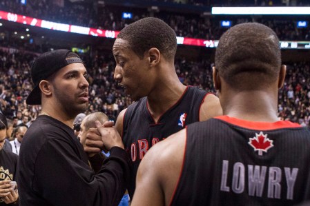 Drake gives Raptors guard Demar Derozan props after a game. Photo: CP