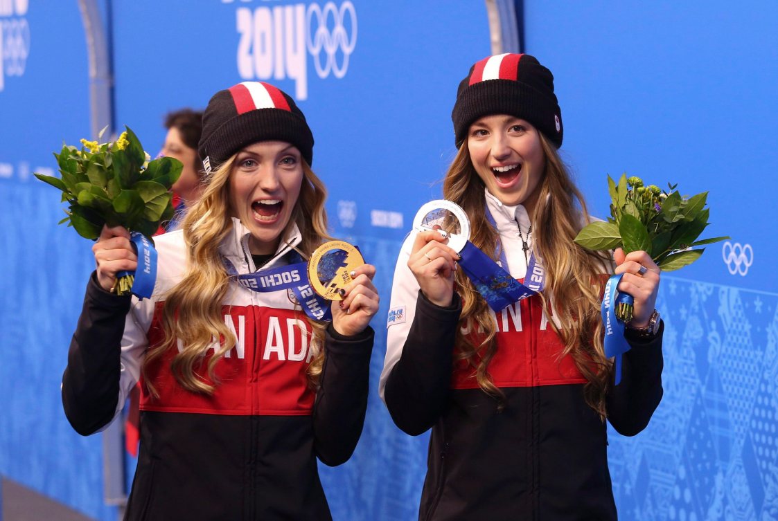 Justine Dufour-Lapointe (left) holds her gold medal and sister Chloe holds here silver for women's moguls after the medal ceremony at the Sochi Winter Olympics in Sochi, Russia, Sunday, Feb. 9, 2014. THE CANADIAN PRESS/HO, COC - Mike Ridewood