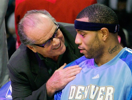 Nicholson gives some tips to Denver Nugget Kenyon Martin. Photo: CP