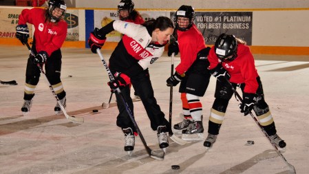 Catherine Ward demonstrates stick-handling techniques on ice.